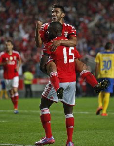 Benfica's Salvio celebrates his goal with teammate John during their Portuguese premier league soccer match against Arouca at Luz stadium in Lisbon